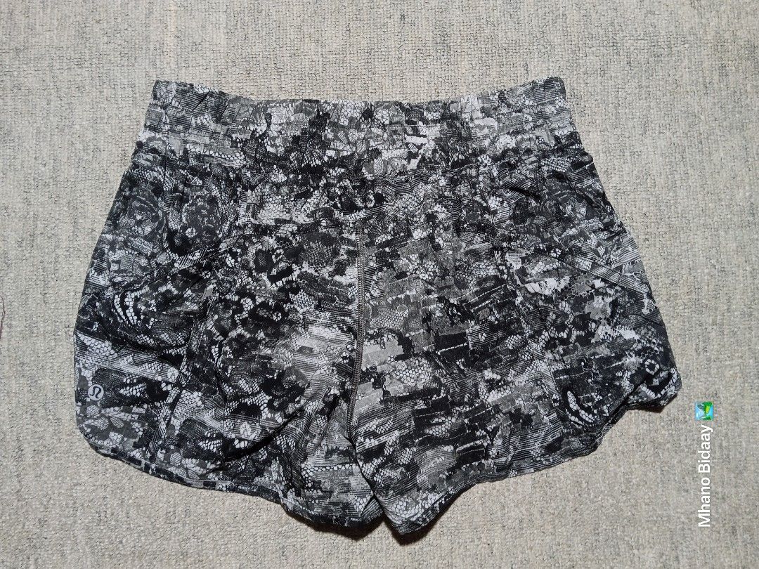 Lululemon Women's 4" Tracker Short V (Category: Activewear) located in Valencia. Submitted by mhano_bidaay_outdoors_218 (Listing ID 1462557918, Image 3). Description: - Lululemon Women's 4" Tracker Shorts - Size on tag: DOT 10 - Waistline: Fits 32-34 inches - Length: 10.5 inches - Leg Opening: 13 inches - Fabric: Quick-drying - Color: Black and grey abstract print - Condition: Good as new - Price: P789 + shipping.