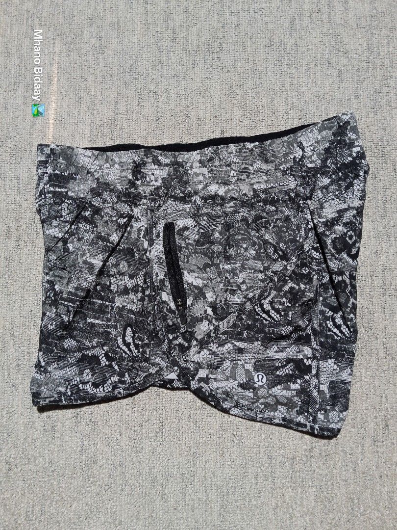Lululemon Women's 4" Tracker Short V (Category: Activewear) located in Valencia. Submitted by mhano_bidaay_outdoors_218 (Listing ID 1462557918, Image 2). Description: - Lululemon Women's 4" Tracker Shorts - Size on tag: DOT 10 - Waistline: Fits 32-34 inches - Length: 10.5 inches - Leg Opening: 13 inches - Fabric: Quick-drying - Color: Black and grey abstract print - Condition: Good as new - Price: P789 + shipping.