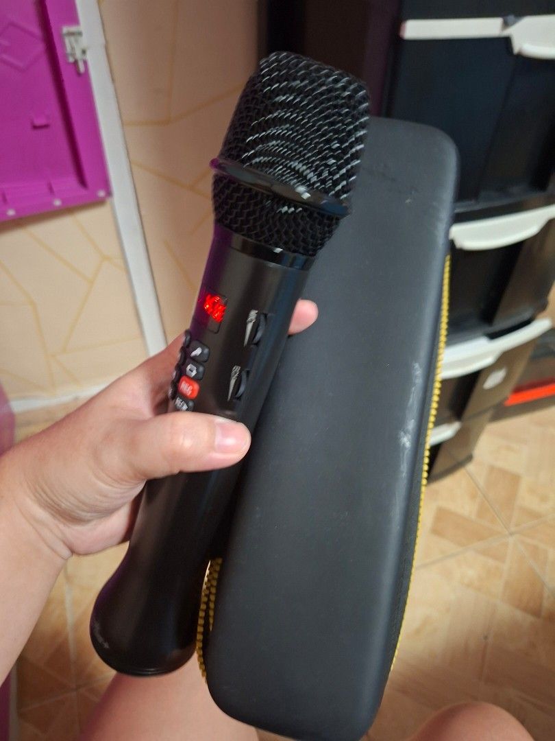 MAGIC CARRY OKE PLUS (Category: Voice Recorders) located in Cainta. Submitted by ennarrivera. (Listing ID 1462517834, Image 3). Description: - MAGIC CARRY OKE PLUS microphone - Sleek black design - Comes with a protective yellow-lined carrying case - Portable and convenient for on-the-go singing - Easy-to-use controls on the handle - Features a clear digital display.