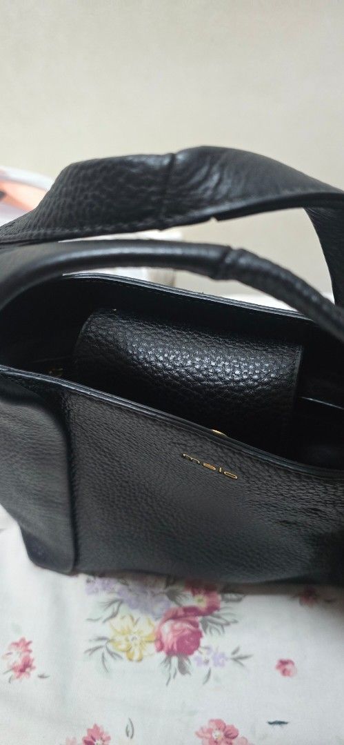 Malo Black Leather Tote Bag (Category: Tote Bags) located in Antipolo. Submitted by happinessprelove (Listing ID 1462565835, Image 3). Description: - Genuine Malo black leather tote bag - Pebbled leather texture for a sophisticated look - Spacious main compartment for all your essentials - Convenient inner pocket for organization - Elegant gold hardware details - Comes with original dust bag - Ideal for everyday wear and versatile styling.