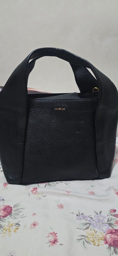 Malo Black Leather Tote Bag (Category: Tote Bags) located in Antipolo. Submitted by happinessprelove (Listing ID 1462565835, Image 1). Description: - Genuine Malo black leather tote bag - Pebbled leather texture for a sophisticated look - Spacious main compartment for all your essentials - Convenient inner pocket for organization - Elegant gold hardware details - Comes with original dust bag - Ideal for everyday wear and versatile styling.