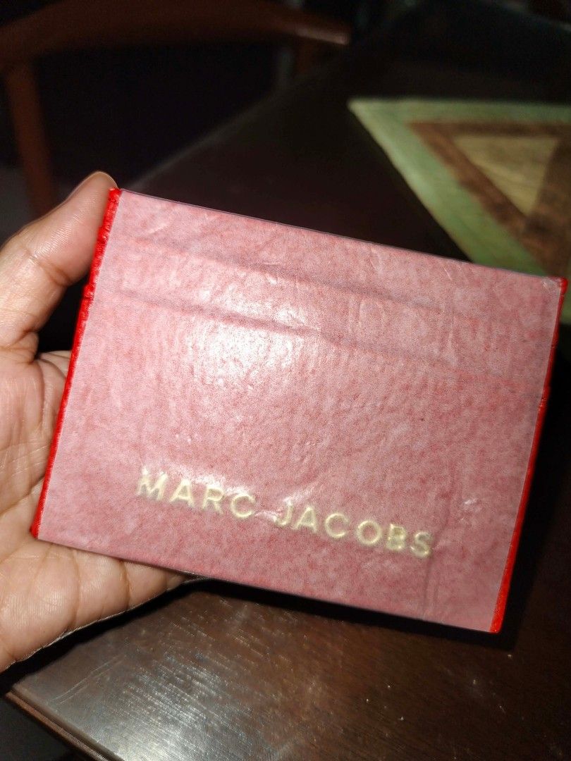 Marc Jacobs Card Holder (Category: Wallets & Card holders) located in Cavite. Submitted by mahthriftshop (Listing ID 1462492467, Image 2). Description: 250 each mop gcash+sf - Brand: Marc Jacobs - Color: Pearl White - Material: Textured leather-like - Features: Multiple card slots - Condition: Comes in original packaging - Benefit: Keeps your cards neatly organized.