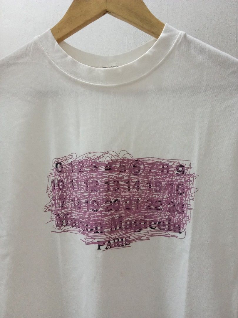 Margiela Numeric logo TShrt (Category: Shirts) located in Manila. Submitted by eriiicaspage (Listing ID 1462449389, Image 2). Description: PreOwned LkeNew Lightly Used Margiela Numers logo t-shirt Medium-Large Cotton - Features the iconic number print with unique scribbled details - Classic crew neck and short sleeve design - Ideal for everyday casual wear No flaws GOod Condition 9/10 .
