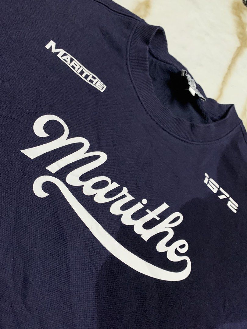 MARITHE FRANCOIS GIRBAUD Navy Blue Sweatshirt Size M (Category: Coats, Jackets and Outerwear) located in Iloilo. Submitted by johnpullan30303 (Listing ID 1462577996, Image 3). Description: - Navy blue Marithe Francois Girbaud sweatshirt - Features brand name and '1972' graphic - Size: Medium (M) - Ideal for everyday casual wear.