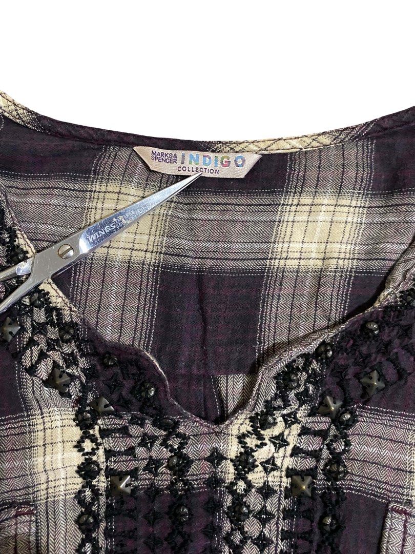 Marks & Spencer Indigo Collection Plaid/Checkered Boho Blouse (Category: Blouses) located in Manila. Submitted by thrift.bell (Listing ID 1462624784, Image 3). Description: size : fits Medium (no size tag, based on measurements) width : 16.5 inch length : 23.5 inch sleeve length : 23 inch Color Rate: 9.5/10 Vibrant dark purple / plum & cream plaid features : beautiful embroidery & beadwork neckline, waist tie strings, chest pockets, adjustable ro