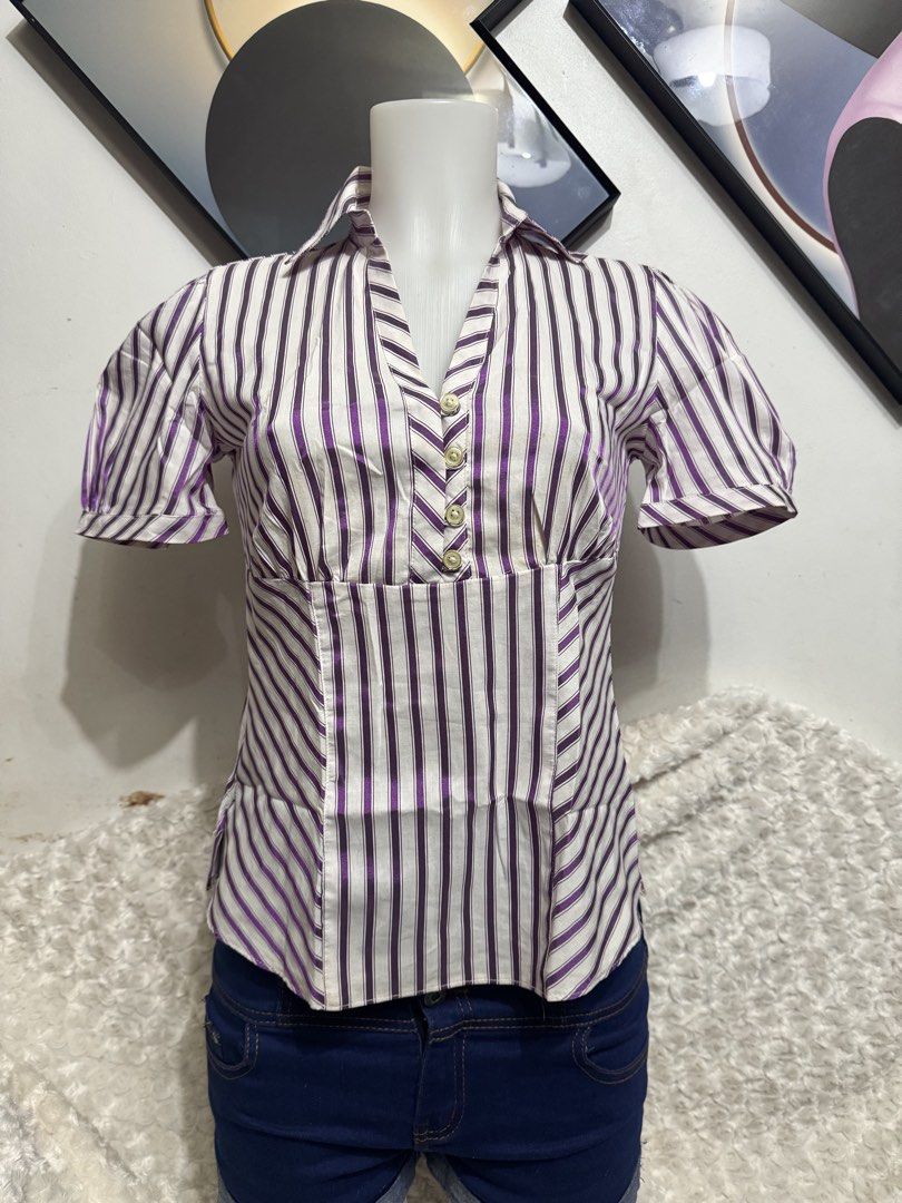 Marks & Spencer Purple and White Striped Button-Up Blouse (Category: Blouses) located in Marikina City. Submitted by lorradel (Listing ID 1462455372, Image 1). Description: - Short-sleeved collared blouse - Purple and white vertical stripe pattern - Button-up front - Cinched waist for a flattering fit - Side slits on the hem - Versatile: pairs well with jeans or shorts - MAY HAVE some washable stains (hindi maiiwasan) needs washing; had been stor