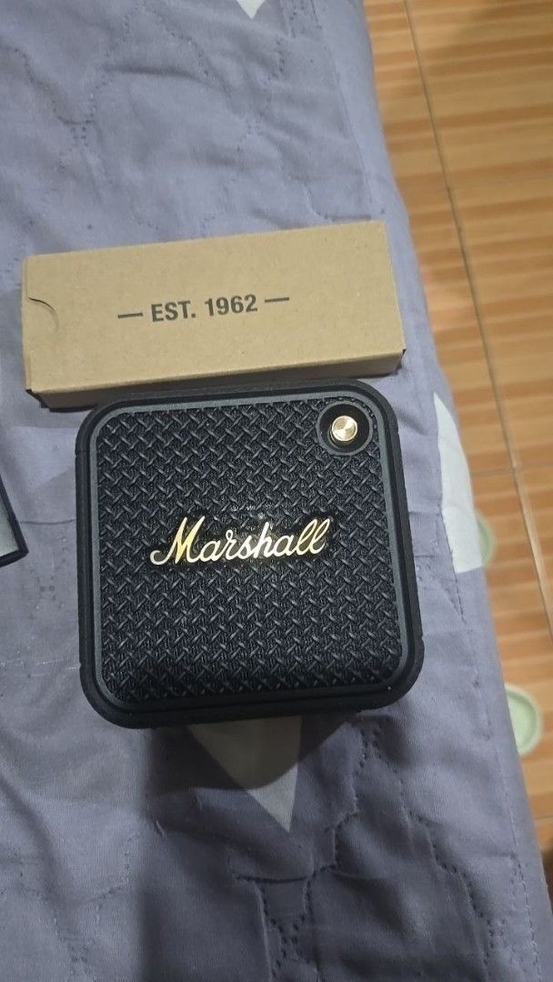 Marshall Willen II Bluetooth Speaker (Category: Soundbars, Speakers & Amplifiers) located in Pateros City. Submitted by jonixyz (Listing ID 1462524726, Image 1). Description: - Marshall Willen II Portable Bluetooth Speaker - Color: Black and Brass - Extended Playtime: 17+ hours on a single charge - Durability: Dust and waterproof design - Portability: Comes with a convenient strap - Ideal for: Taking your music anywhere - Purchase Date: April 13,