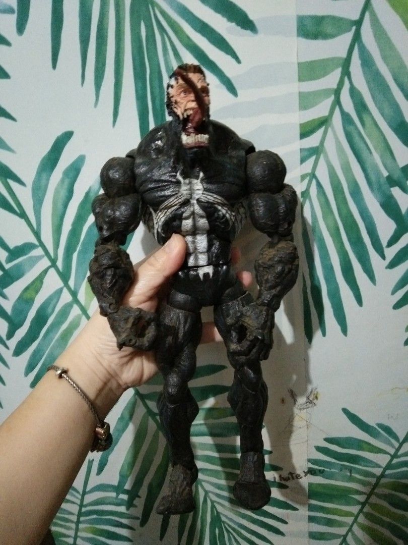 Marvel Venom Action Figure Toy (Category: Figurines & Statues) located in Quezon City. Submitted by eidorableshop (Listing ID 1462446534, Image 1). Description: - Cool Venom action figure - Black and white design with detailed - Poseable limbs for display - vintage - Perfect for collectors and fans.