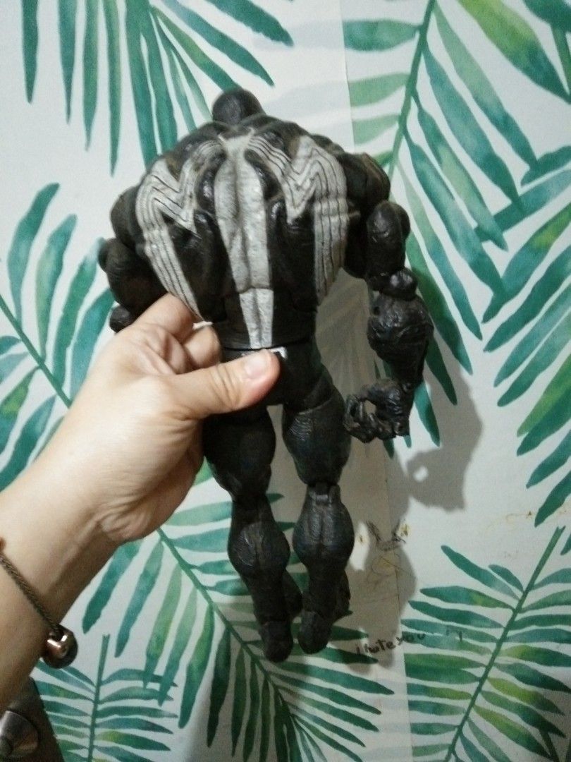 Marvel Venom Action Figure Toy (Category: Figurines & Statues) located in Quezon City. Submitted by eidorableshop (Listing ID 1462446534, Image 2). Description: - Cool Venom action figure - Black and white design with detailed - Poseable limbs for display - vintage - Perfect for collectors and fans.