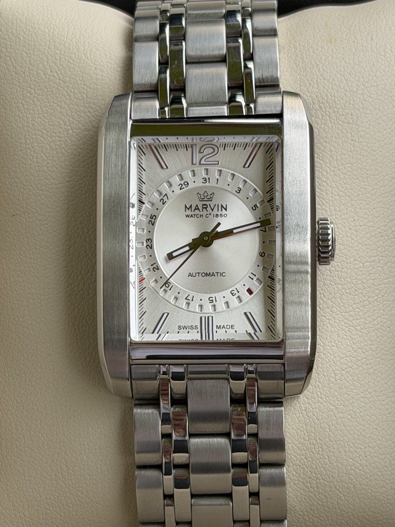 Marvin Watch C. 1850 Rectangular Automatic Pointer Date (Category: Luxury Watches) located in Quezon City. Submitted by lucas_luxuries (Listing ID 1462494774, Image 3). Description: For sale/trade Marvin Watch C. 1850 Rectangular Automatic Pointer Date ₱32,500 only • Reference: M107.13.21.74 • Condition: 9/10 • Inclusions: Box, travel case, manual, cards, extra links, etc. • Swiss automatic movement with Caliber Sellita200 • Hacking seconds • 38 
