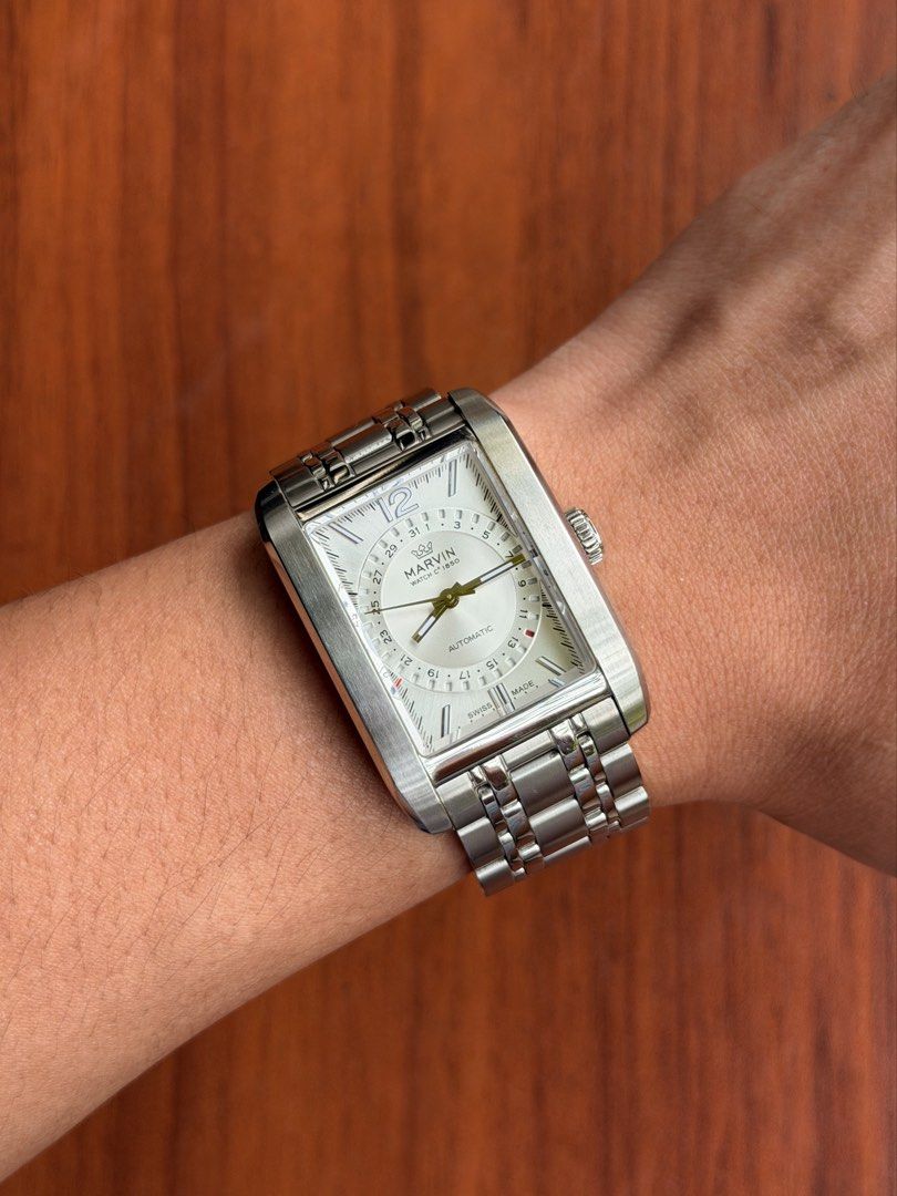 Marvin Watch C. 1850 Rectangular Automatic Pointer Date (Category: Luxury Watches) located in Quezon City. Submitted by lucas_luxuries (Listing ID 1462494774, Image 1). Description: For sale/trade Marvin Watch C. 1850 Rectangular Automatic Pointer Date ₱32,500 only • Reference: M107.13.21.74 • Condition: 9/10 • Inclusions: Box, travel case, manual, cards, extra links, etc. • Swiss automatic movement with Caliber Sellita200 • Hacking seconds • 38 