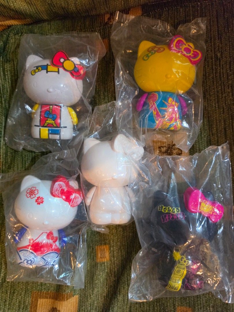 McDo x Hello Kitty (Category: Character Goods) located in Baguio. Submitted by shellcollector (Listing ID 1462528192, Image 2). Description: McDonald X SANRIO Hello Kitty 2015 Asia Limited World Travel set PVC Material Sealed in plastic Complete set of 5 4 with designs, 1 plane white 1500 Pesos Baguio shipping.