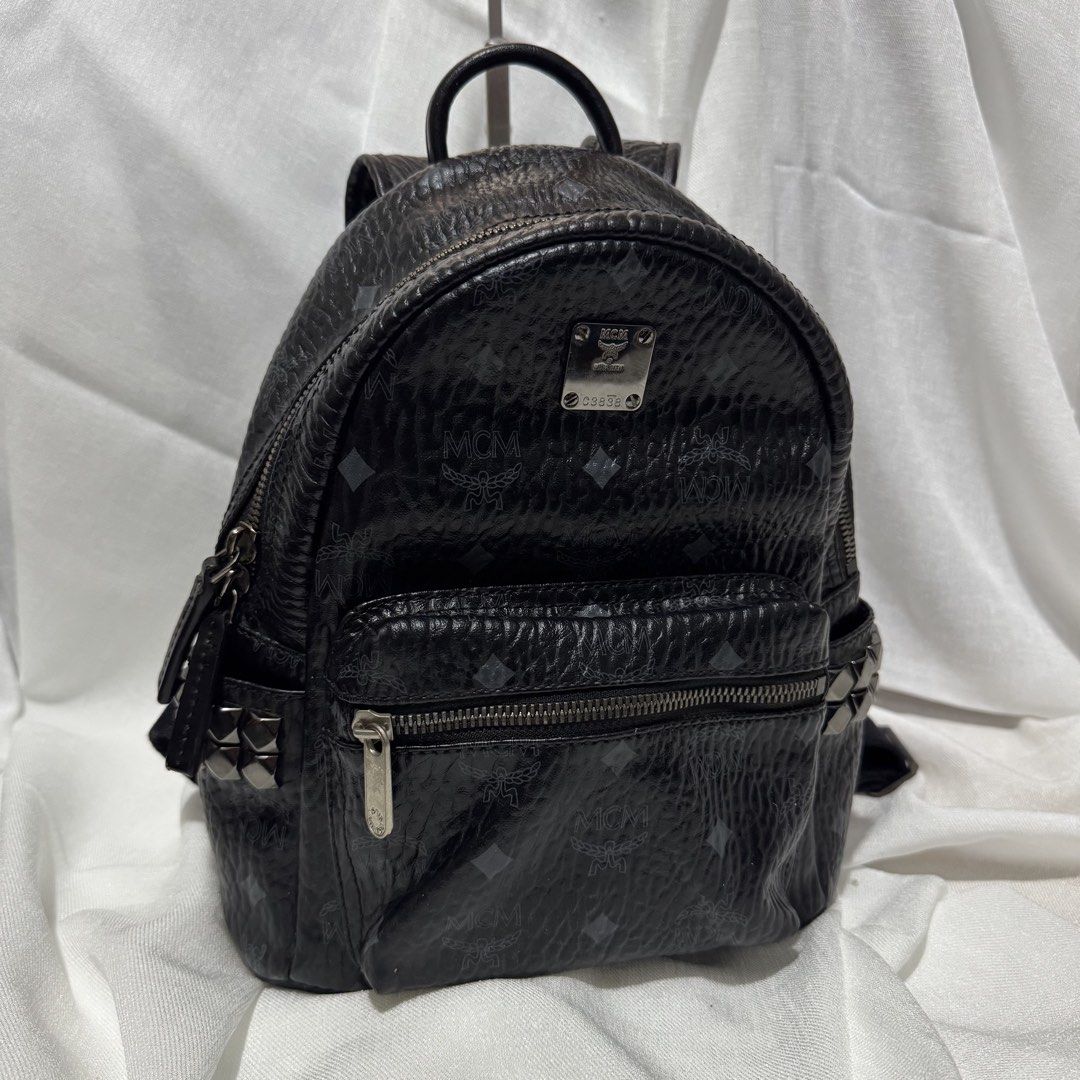 MCM Black Monogram Mini Backpack (Category: Backpacks) located in Las Pinas. Submitted by declutterqueen_00 (Listing ID 1462657694, Image 2). Description: ✨ Preloved Collection Note ✨ Please manage expectations as these are preloved items. Authenticity is not guaranteed, but serial/date codes are present. Sold as-is. - All-over signature monogram print - Stylish silver hardware with stud accents on front pockets - Secure zipper closure - Interior