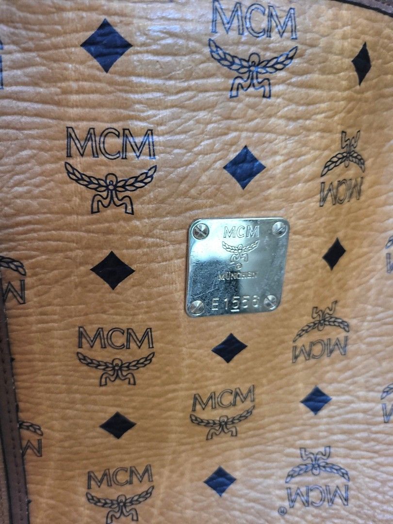MCM Cognac Visetos Tote Bag (Category: Luxury Bags & Wallets) located in Antipolo. Submitted by dlolin (Listing ID 1462644744, Image 2). Description: - Classic MCM tote bag - Features iconic Visetos print - Genuine leather trim and handles - Interior pockets for organization - Minor signs of wear on corners and inside - Perfect for everyday use.