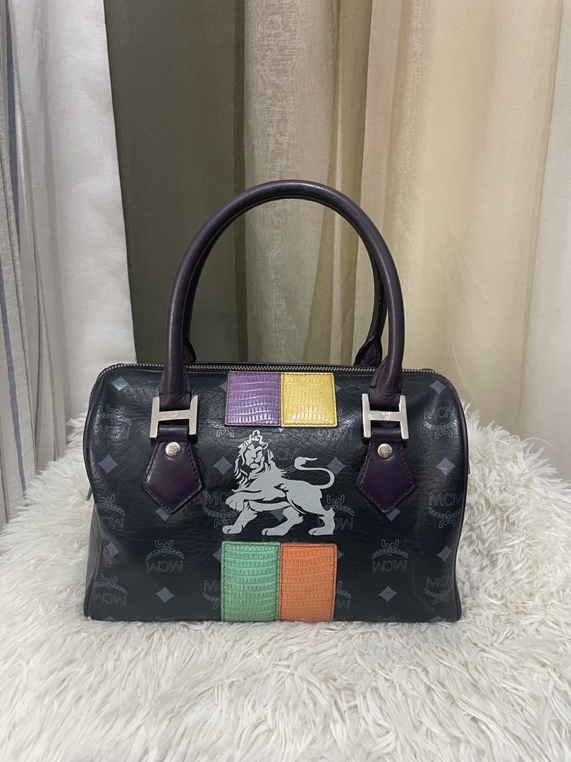 MCM Lion Patchwork Visetos Boston Bag (Black/Purple) (Category: Luxury Bags & Wallets) located in Cabanatuan. Submitted by moraiahraven (Listing ID 1462667953, Image 1). Description: Authentic MCM Lion Patchwork Visetos Boston Bag (Black/Purple).
