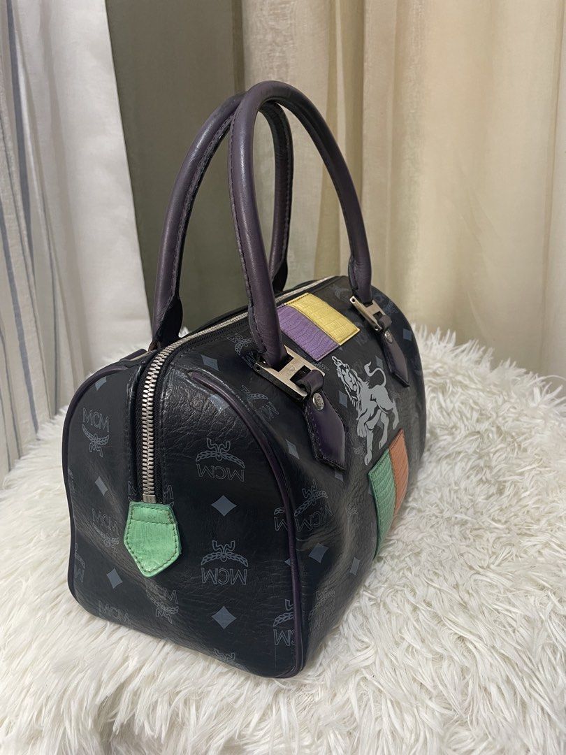 MCM Lion Patchwork Visetos Boston Bag (Black/Purple) (Category: Luxury Bags & Wallets) located in Cabanatuan. Submitted by moraiahraven (Listing ID 1462667953, Image 2). Description: Authentic MCM Lion Patchwork Visetos Boston Bag (Black/Purple).