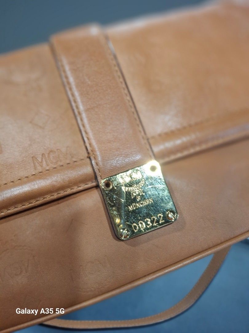 MCM Monogram Leather Shoulder Bag (Category: Luxury Bags & Wallets) located in Cavite. Submitted by bee.geema (Listing ID 1462534196, Image 2). Description: - Authentic MCM shoulder bag - Classic all-over monogram pattern - Gold hardware details - MCM logo lining inside - Adjustable strap for comfort - Ideal for everyday wear.