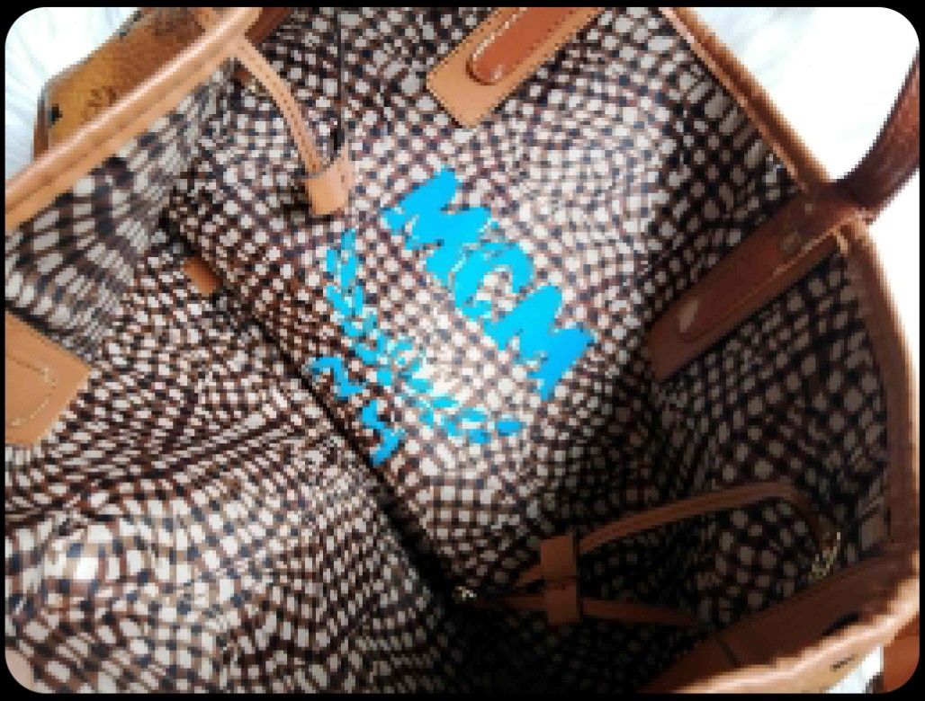 MCM Monogram Tote Bag (Category: Luxury Bags & Wallets) located in Midsayap. Submitted by purse_gedo (Listing ID 1462615442, Image 3). Description: - Classic MCM tote bag - Brown monogram print with leather trim - Interior with checkered lining and MCM logo - Handles show wear and peeling - Ideal for everyday use.