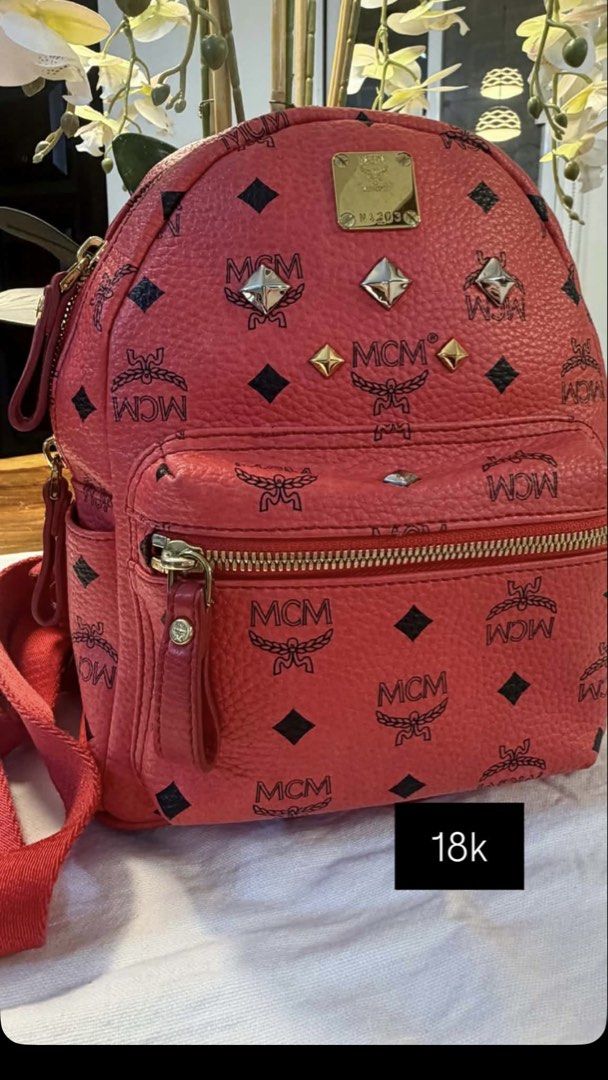 MCM Stark Special Studded Mini Backpack (Category: Backpacks) located in Quezon City. Submitted by leens.preloved (Listing ID 1462627612, Image 1). Description: - Cute pink MCM backpack - Signature monogram print - Gold and silver stud details - Front zip pocket - Side pockets - Adjustable straps - Great for everyday use.