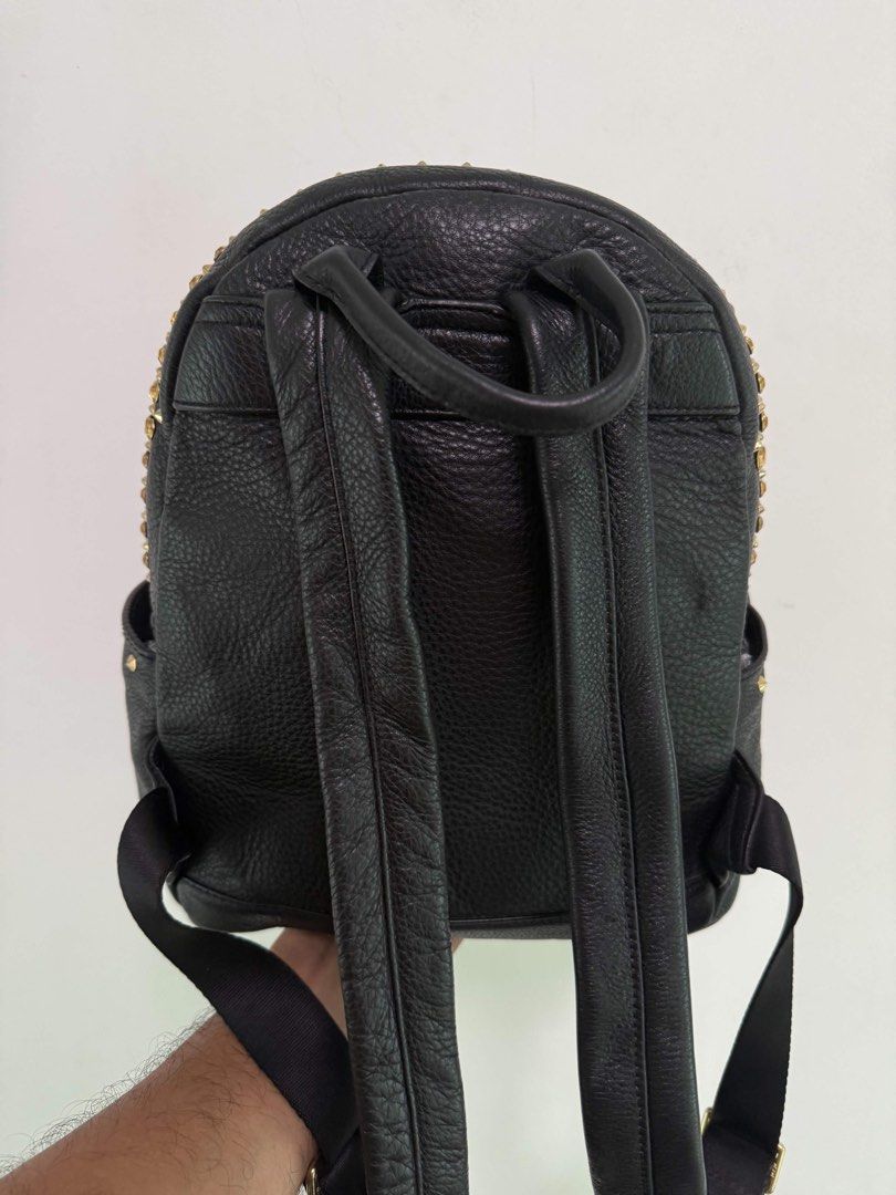 MCM Studded Mini Black Leather Backpack (Category: Backpacks) located in Manila. Submitted by limsanity03 (Listing ID 1462594314, Image 2). Description: - Genuine black leather MCM backpack - Stylish gold stud detailing - Convenient front zip pocket - Adjustable straps for comfort - Prominent MCM logo plate - Spacious interior for essentials - Ideal for everyday use and travel.