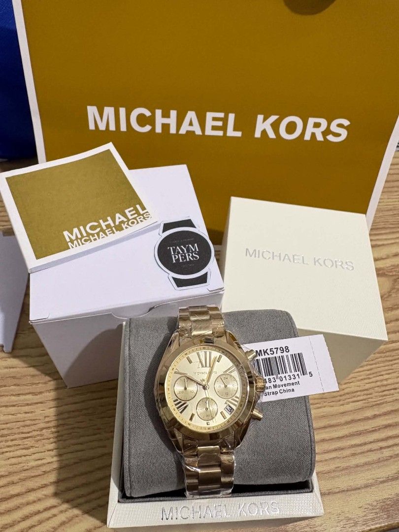 Michael Kors MK5798 Gold Chronograph Watch (Category: Women's Watches) located in Tabaco. Submitted by angelicaloves (Listing ID 1462511224, Image 1). Description: - Authentic Gold Michael Kors Watch - Model: MK5798 - Features: Chronograph function - Strap: Gold-tone stainless steel - Includes: Original packaging and box - Condition: Great for everyday wear or special occasions.