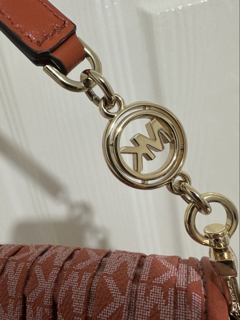 Michael Kors Monogram Shoulder Bag (Category: Shoulder Bags) located in Bulacan. Submitted by declutterwithme128 (Listing ID 1462631450, Image 3). Description: - quite small cracks in the bag (unnoticeable) - can send more pics - original (not class a or high quality) - bought in malaysia (michael kors store) - still in very good condition - very pretty in person - can send more pics just dm - slightly negotiable pass sa low ballers - bulacan / p