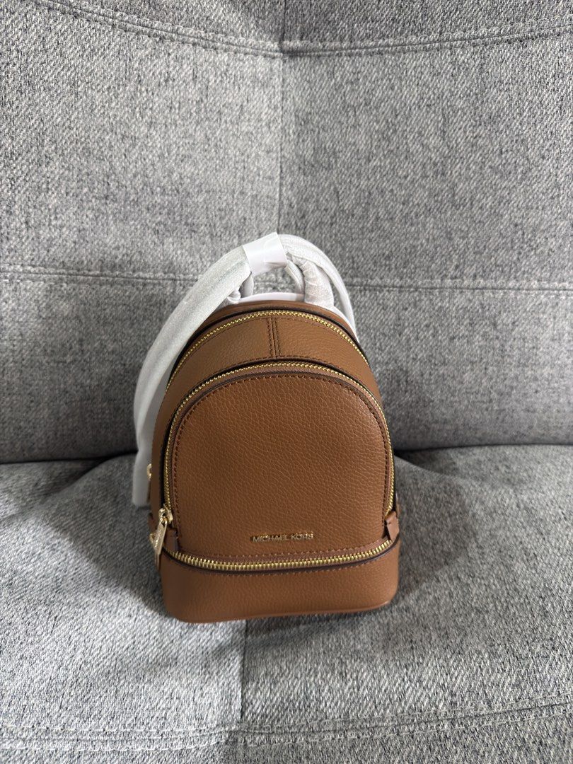 Michael Kors Rhea Extra-Small Pebbled Leather Backpack (Category: Backpacks) located in Las Pinas. Submitted by bestthriftinspo (Listing ID 1462677616, Image 1). Description: - Authentic Michael Kors brown leather backpack in Brown .