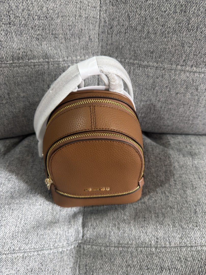 Michael Kors Rhea Extra-Small Pebbled Leather Backpack (Category: Backpacks) located in Las Pinas. Submitted by bestthriftinspo (Listing ID 1462677616, Image 2). Description: - Authentic Michael Kors brown leather backpack in Brown .