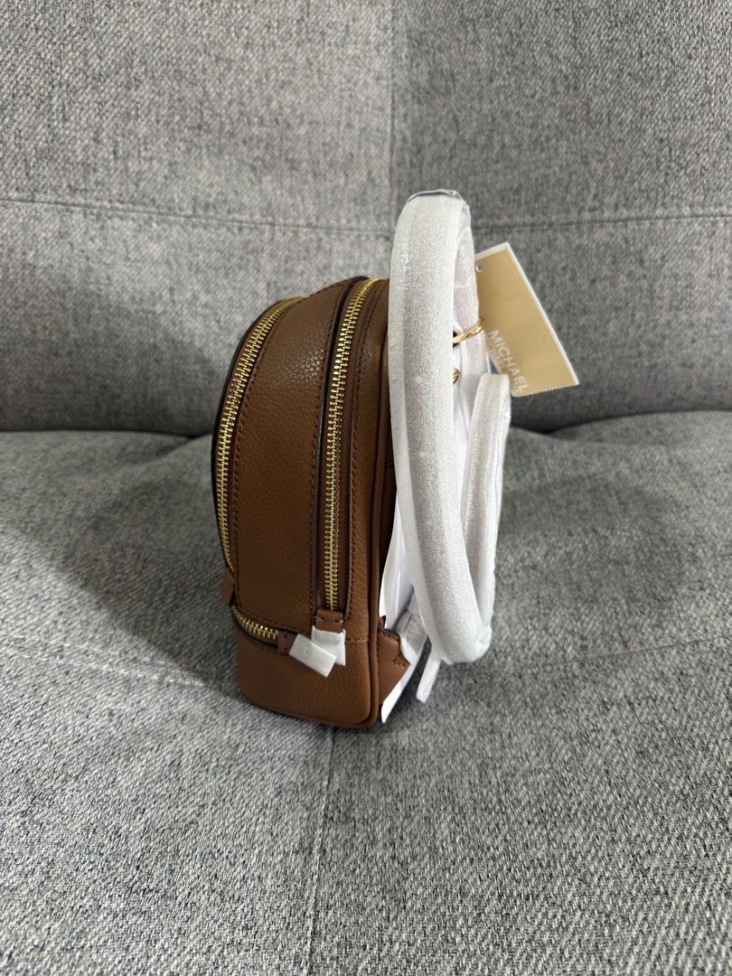 Michael Kors Rhea Extra-Small Pebbled Leather Backpack (Category: Backpacks) located in Las Pinas. Submitted by bestthriftinspo (Listing ID 1462677616, Image 3). Description: - Authentic Michael Kors brown leather backpack in Brown .