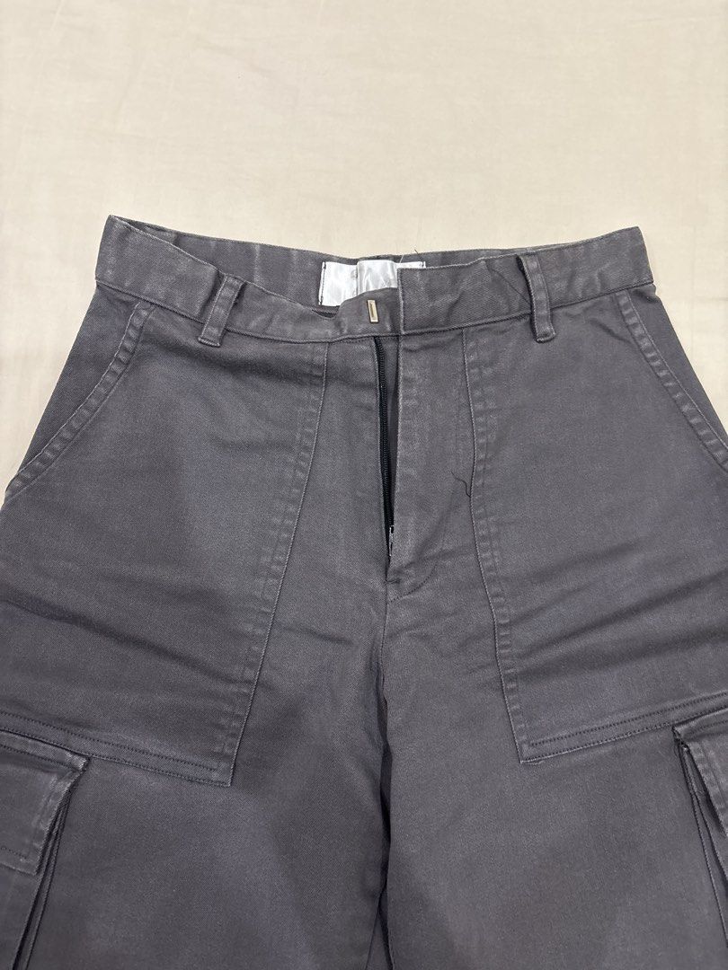 Miu the Label Cargo Pants (Category: Other Bottoms) located in Paranaque City. Submitted by kaescloset.18 (Listing ID 1462562989, Image 2). Description: - Bundle includes 2 pairs of cargo pants: 1 light beige, 1 dark grey. - gray cargo pants (a bit faded) - cream cargo pants (has yellow stains from storage).