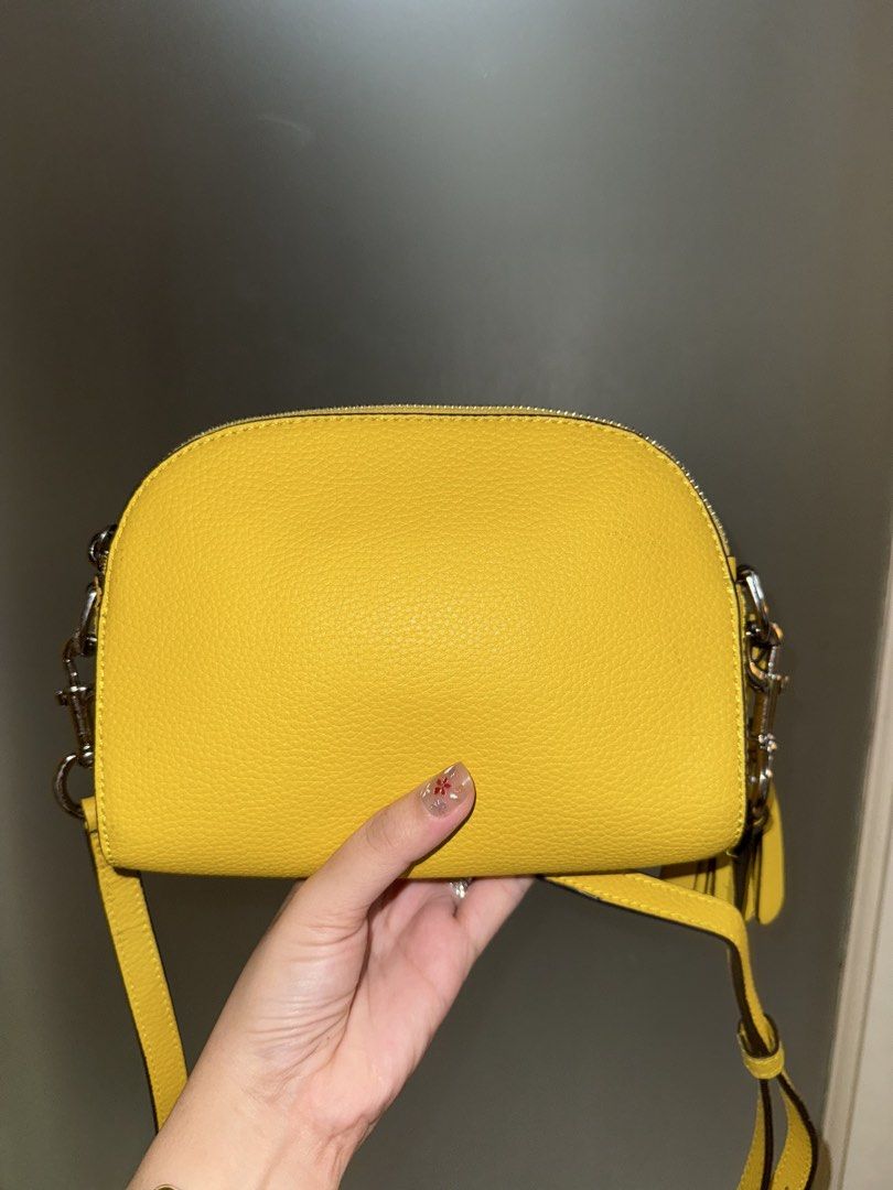 MJ Camera Bag (Category: Luxury Bags & Wallets) located in Makati City. Submitted by amos411 (Listing ID 1462457818, Image 2). Description: Original MJ Shutter Cam bag Size: Small Has 2 zipper compartments Flaws: replaced zipper pullers With signs of use RFS: decluttering.