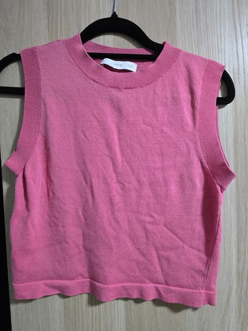 MNG Pink Knit Cropped Top (Category: Sleeveless) located in Quezon City. Submitted by mrstan777 (Listing ID 1462501935, Image 1). Description: - Pink knit top from MNG - Short sleeves, cropped style - Soft and comfortable material - Versatile for casual wear or layering - Pairs well with jeans or skirts.