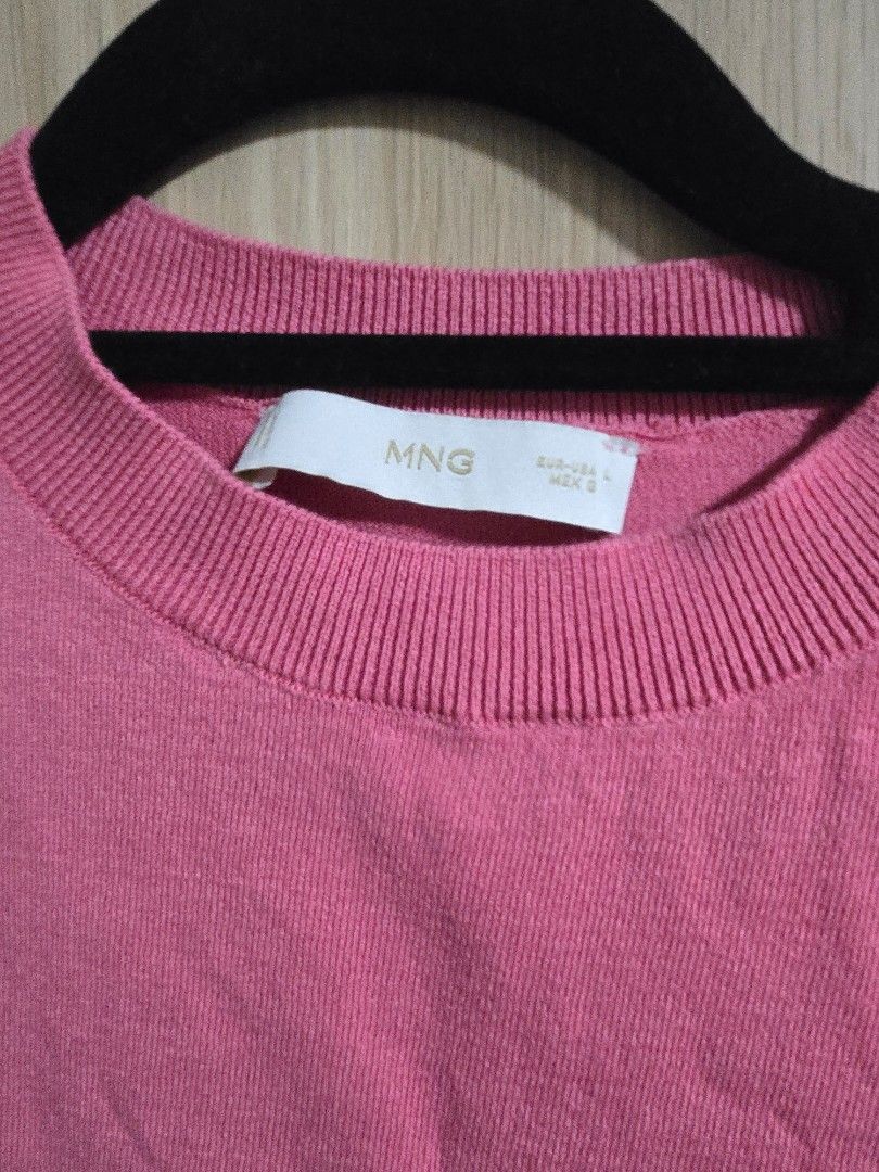 MNG Pink Knit Cropped Top (Category: Sleeveless) located in Quezon City. Submitted by mrstan777 (Listing ID 1462501935, Image 2). Description: - Pink knit top from MNG - Short sleeves, cropped style - Soft and comfortable material - Versatile for casual wear or layering - Pairs well with jeans or skirts.