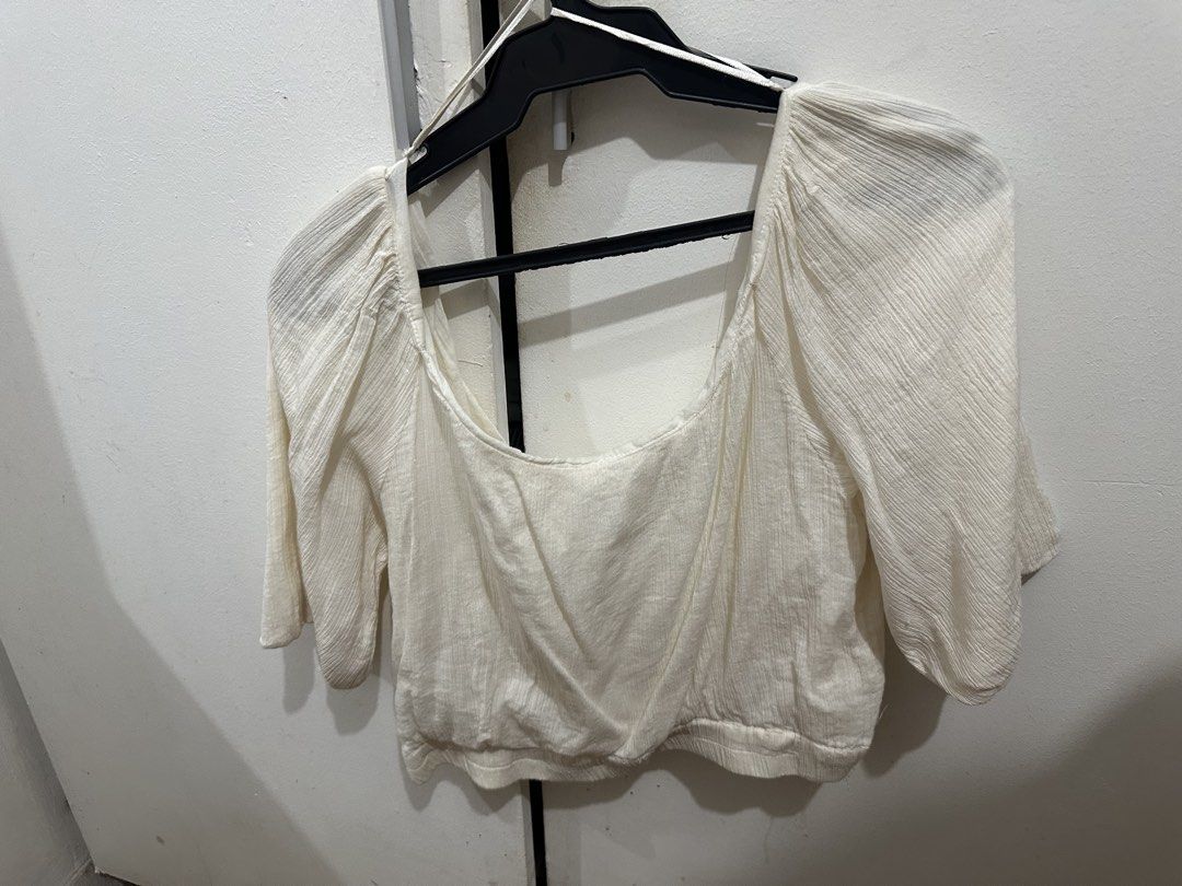 MNG White Puff Sleeve Square Neck Crop Top (Category: Blouses) located in Mandaluyong City. Submitted by gbtnhc (Listing ID 1462458795, Image 2). Description: - Never worn - White crop top with puff sleeves - Square neckline, with textured fabric - RFS: not my style, doesn’t fit me well.