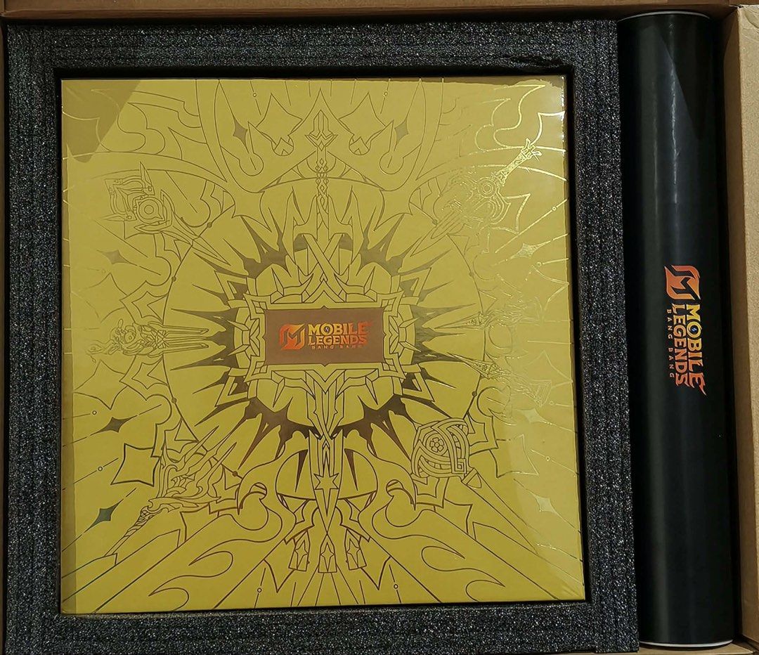 Mobile Legends BangBang 10-Year Voyage (Category: In-Game Products) located in Manila. Submitted by joandaise0125 (Listing ID 1462592818, Image 3). Description: The artbook comes packaged inside a premium gold-themed collector’s edition box set. The bundle includes: - Canvas Tote Bag - 6 Exclusive Postcards - Clear Collectible Cards - MLBB Sticker Pack.