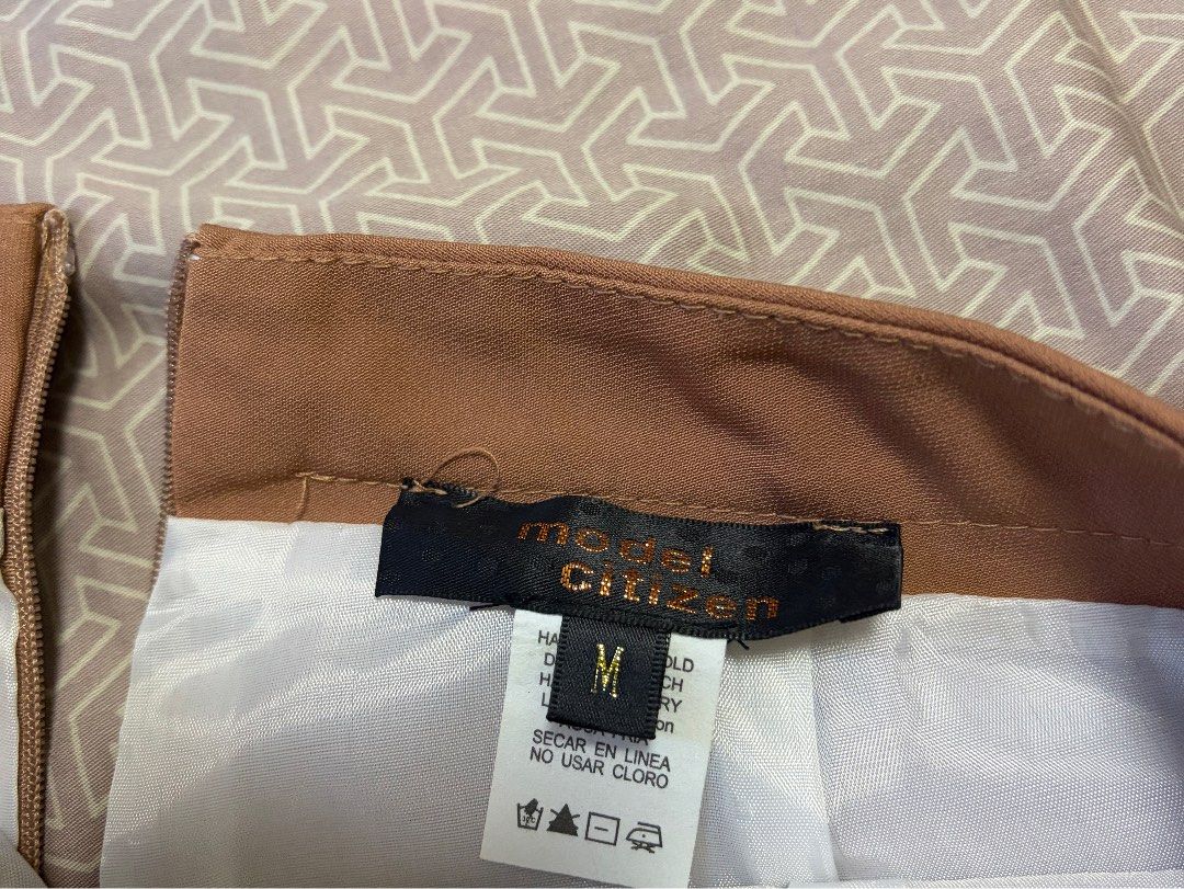 Model Citizen High Waisted Button Detail Shorts (Category: Shorts) located in Manila. Submitted by shopmeph (Listing ID 1462651583, Image 2). Description: - Modern Citizen high-waisted shorts - Neutral tan color - Decorative buttons on front pockets - Back zipper closure - Perfect for dressing up or down.