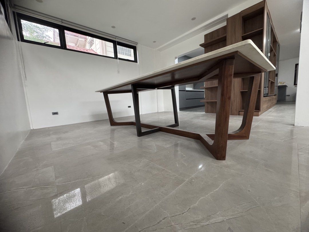 Long, Custom Dining Table with White Quartz Top and Solid Wood Base (Category: Tables & Sets) located in Quezon City. Submitted by applesvee (Listing ID 1462544036, Image 2). Description: - warm minimalist dining table with a sleek white quartz top -Dimensions: 2.70m L x 1.00m W x .75m Ht. - Sturdy and stylish solid wood base. - Comfortably seats 10-12 people. - Perfect for contemporary home aesthetics..