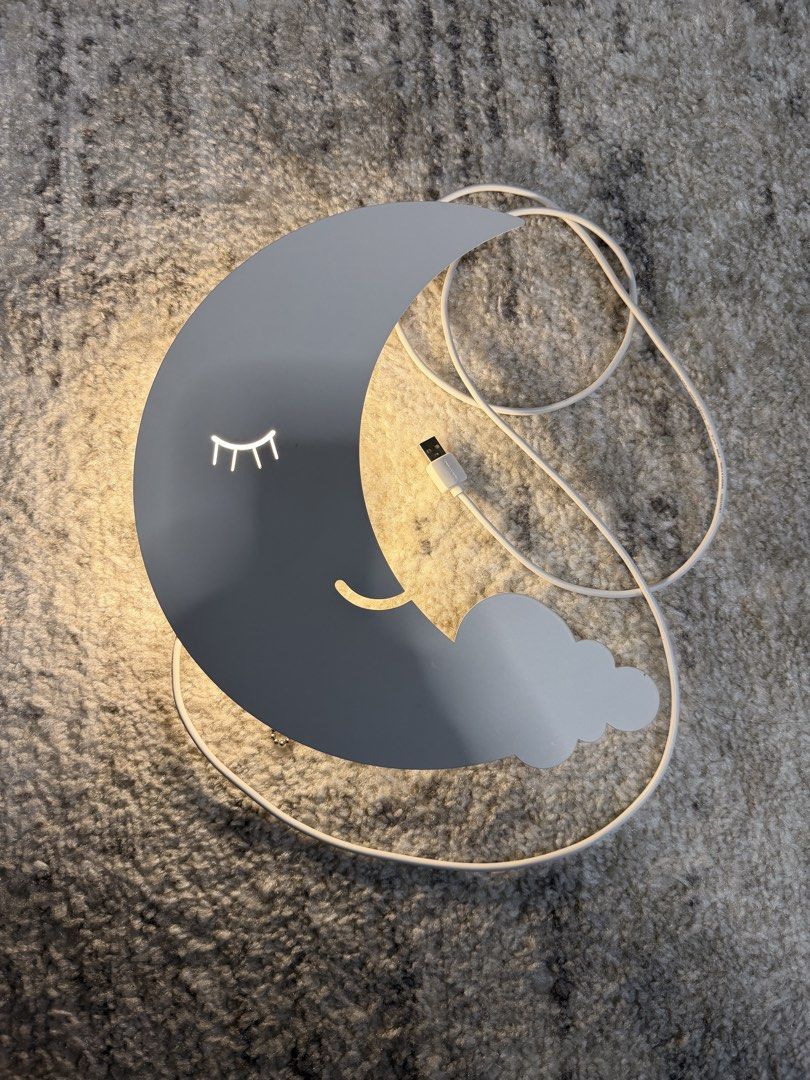 Moon and Cloud Night Light USB Powered (Category: Lighting) located in Rizal. Submitted by karlaquijanomd (Listing ID 1462491828, Image 2). Description: - Adorable moon and cloud design with sleepy eye detail. - Convenient USB powered operation. - Emits a warm, soft, gentle glow. - Ideal for children's bedrooms or as a soothing night light. - Comes with a white USB cable..