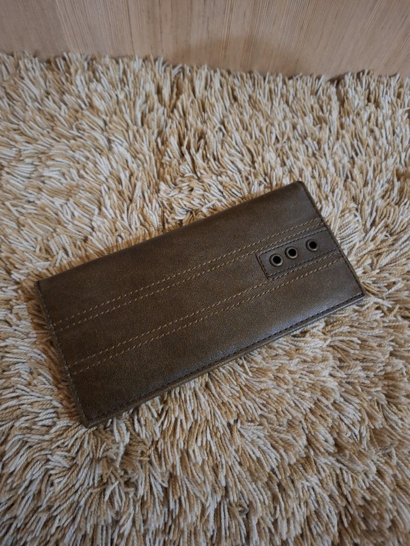 MSE Brown Leather Long Wallet with Zipper (Category: Wallets & Card holders) located in Rizal. Submitted by mirisica (Listing ID 1462566397, Image 2). Description: - Genuine brown leather long wallet - Multiple card slots for organization - Internal zippered compartment for secure storage - Clear ID window for easy access - Decorative exterior stitching and three eyelet details - Measures approximately 7.5 inches in length when closed.