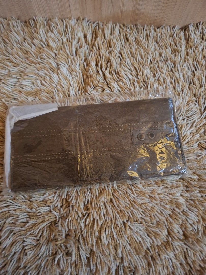 MSE Brown Leather Long Wallet with Zipper (Category: Wallets & Card holders) located in Rizal. Submitted by mirisica (Listing ID 1462566397, Image 1). Description: - Genuine brown leather long wallet - Multiple card slots for organization - Internal zippered compartment for secure storage - Clear ID window for easy access - Decorative exterior stitching and three eyelet details - Measures approximately 7.5 inches in length when closed.