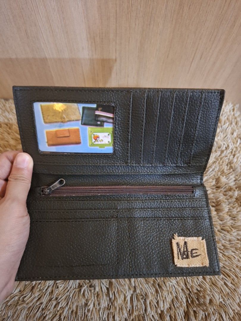 MSE Brown Leather Long Wallet with Zipper (Category: Wallets & Card holders) located in Rizal. Submitted by mirisica (Listing ID 1462566397, Image 3). Description: - Genuine brown leather long wallet - Multiple card slots for organization - Internal zippered compartment for secure storage - Clear ID window for easy access - Decorative exterior stitching and three eyelet details - Measures approximately 7.5 inches in length when closed.
