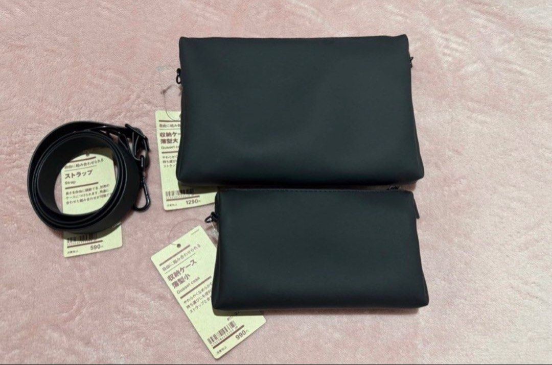 Muji Black Gusset Cases (Small & Large) with Strap (Category: Clutches) located in Pasay City. Submitted by szepter (Listing ID 1462444439, Image 1). Description: - Set of 2 Muji gusset storage cases - Color: Black - Sizes: 1 Large, 1 Small - Features: Zippers, internal pockets - Includes: Black strap - Ideal for organizing essentials - Can be used together or separately - Brand new with tags still attached.