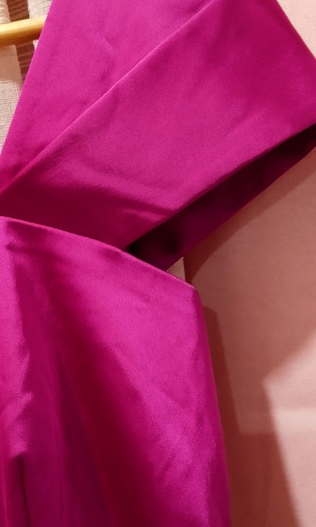 Fuschia cocktail dress (Category: Evening dresses & gowns) located in Cabanatuan. Submitted by miss.maia (Listing ID 1462662367, Image 3). Description: Cocktail Dress featured here in the fuchsia/magenta color option. It is a sheath-style cocktail dress crafted from sleek satin, characterized by its off-the-shoulder straps, a squared neckline, and a prominent structured waist bow.