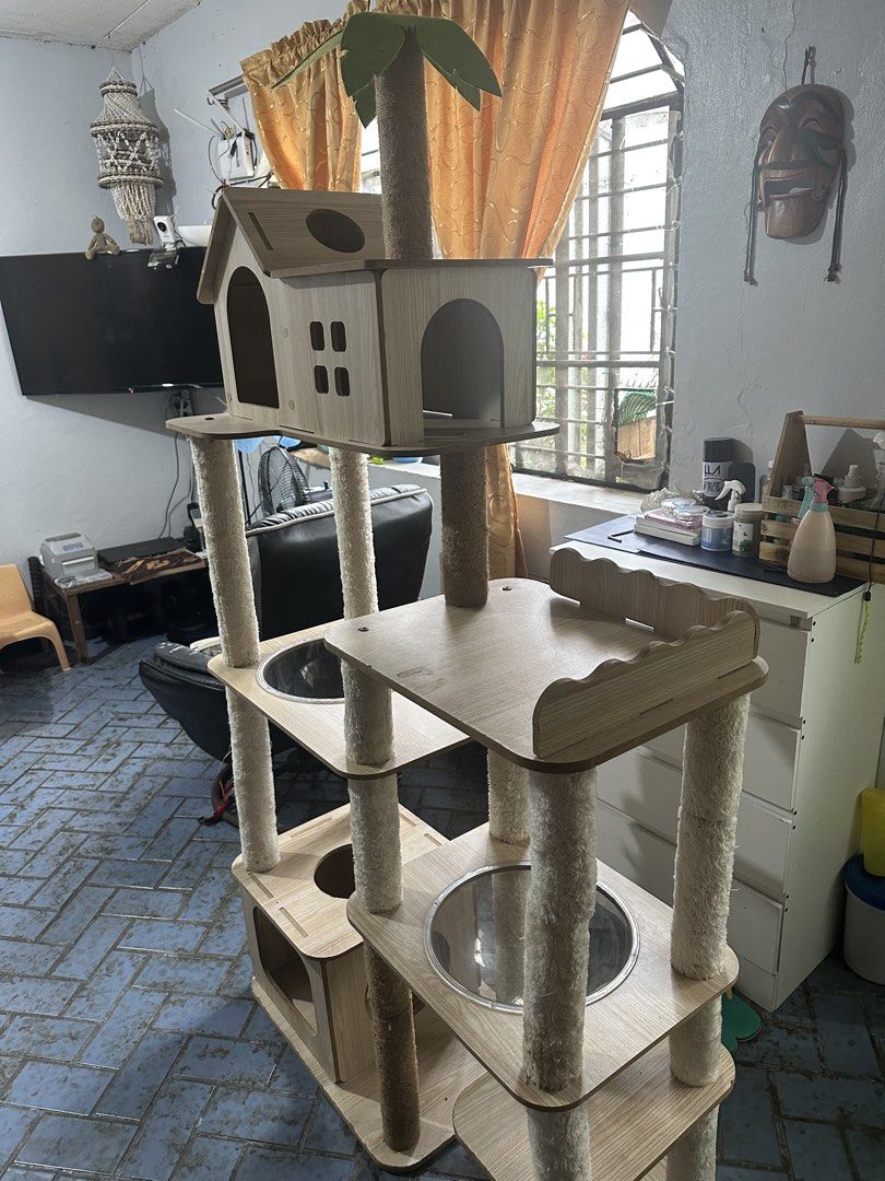 Multi-Level Cat Tree Condo with Hammocks and Perches (Category: Homes & Other Pet Accessories) located in San Pedro. Submitted by mysticdog_8deb08 (Listing ID 1462515338, Image 3). Description: - Bought at Amazon for 8,000 - Height 5’6 - Tall cat tree with multiple levels for climbing and lounging. - Features cozy hideaways for napping. - Includes scratching posts to satisfy natural instincts. - Stylish wooden design complements home decor. - Stu