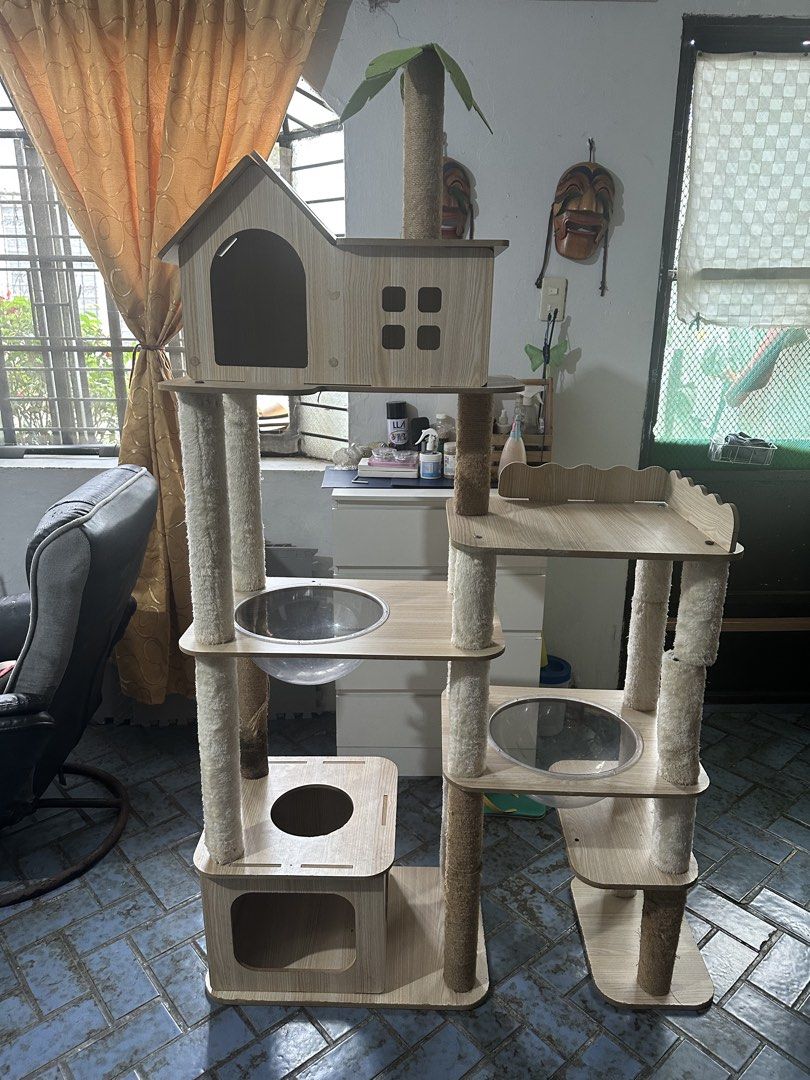 Multi-Level Cat Tree Condo with Hammocks and Perches (Category: Homes & Other Pet Accessories) located in San Pedro. Submitted by mysticdog_8deb08 (Listing ID 1462515338, Image 1). Description: - Bought at Amazon for 8,000 - Height 5’6 - Tall cat tree with multiple levels for climbing and lounging. - Features cozy hideaways for napping. - Includes scratching posts to satisfy natural instincts. - Stylish wooden design complements home decor. - Stu