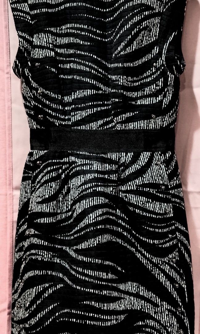 MUSE Black and white zebra-patterned sheath dress (Category: Dresses) located in Cabanatuan. Submitted by miss.maia (Listing ID 1462656690, Image 1). Description: This item is a black and white zebra-patterned sheath dress from the contemporary brand Muse. It features a sleeveless cut, a solid black waistband accentuating the silhouette, and a quilted/textured fabric decorated with subtle rhinestone or bead embellishments throughout the pattern. 