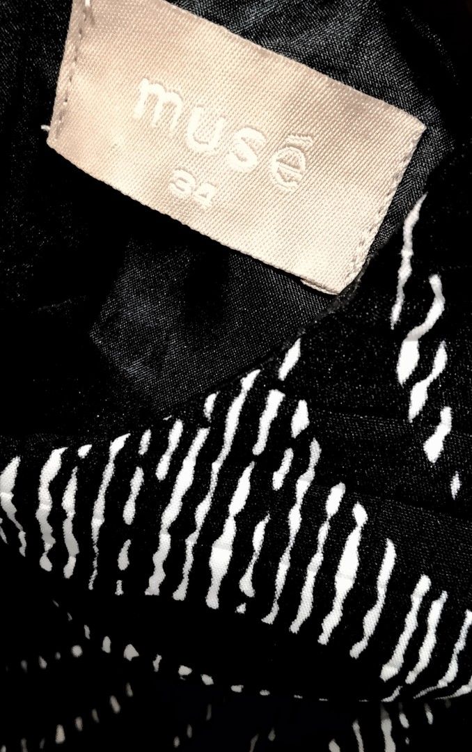 MUSE Black and white zebra-patterned sheath dress (Category: Dresses) located in Cabanatuan. Submitted by miss.maia (Listing ID 1462656690, Image 3). Description: This item is a black and white zebra-patterned sheath dress from the contemporary brand Muse. It features a sleeveless cut, a solid black waistband accentuating the silhouette, and a quilted/textured fabric decorated with subtle rhinestone or bead embellishments throughout the pattern. 