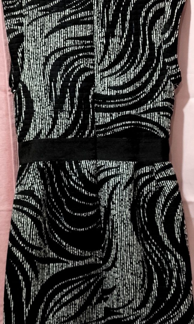 MUSE Black and white zebra-patterned sheath dress (Category: Dresses) located in Cabanatuan. Submitted by miss.maia (Listing ID 1462656690, Image 2). Description: This item is a black and white zebra-patterned sheath dress from the contemporary brand Muse. It features a sleeveless cut, a solid black waistband accentuating the silhouette, and a quilted/textured fabric decorated with subtle rhinestone or bead embellishments throughout the pattern. 