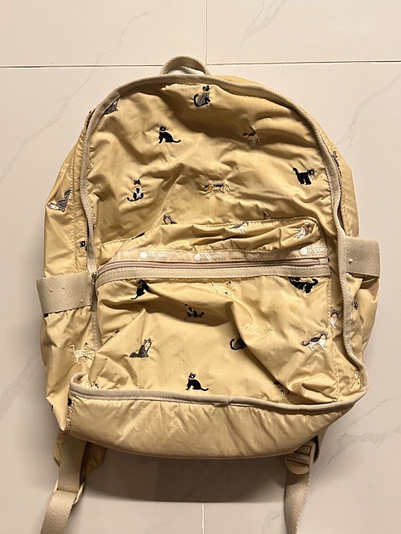 Must go! Cat backpack (Category: Backpacks) located in Manila. Submitted by vccustods339 (Listing ID 1460157683, Image 1). Description: Rfs: decluttering! Negotiable! Has embroidered cats kn it, honest issue: has marker stain sa likod Message me for more details!.
