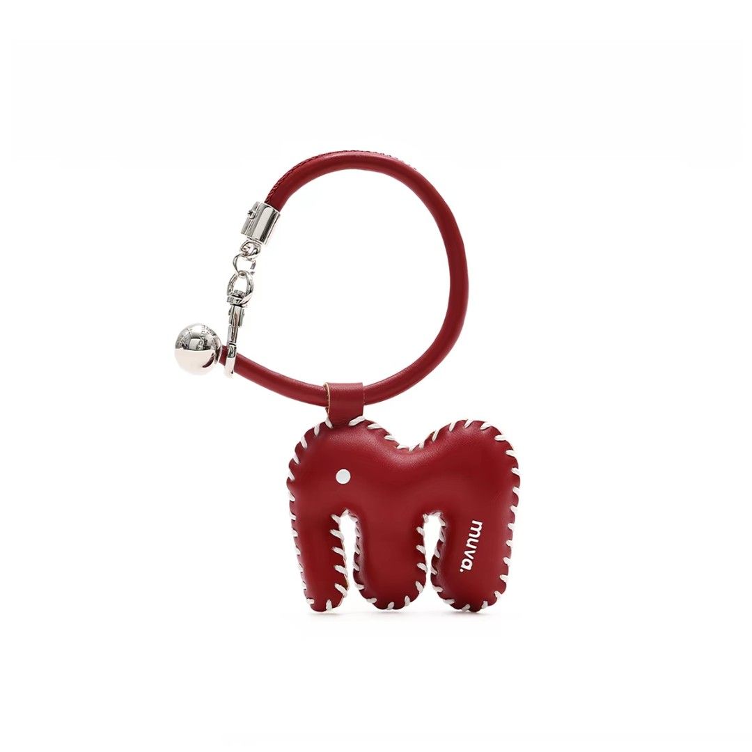 Muva. Elephant Charm Keychain with Bell (Category: Other Stationery & Craft) located in Manila. Submitted by litphilofashion (Listing ID 1462641468, Image 2). Description: - Adorable elephant charm keychain - Made of brown suede with white stitching, also available in Red - Features a small, tinkling bell - 'Muva.' brand detail - Ideal accessory for bags or keys.